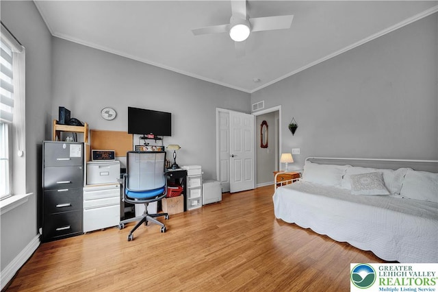 4693 Bluegrass Ln, Lower Macungie Twp, PA 18062 - bedroom featuring multiple windows, light wood-type flooring, ornamental molding, a ceiling fan, and an office area