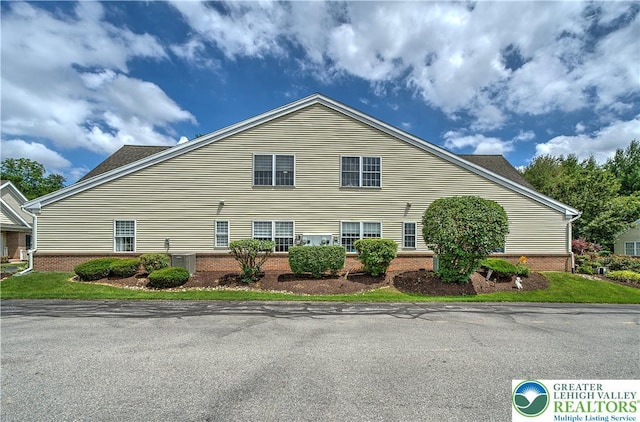4693 Bluegrass Ln, Lower Macungie Twp, PA 18062 - view of side of home featuring brick siding
