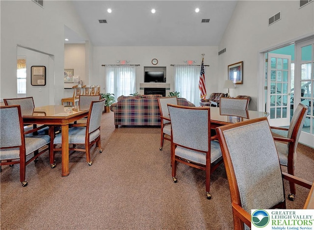 4693 Bluegrass Ln, Lower Macungie Twp, PA 18062 - dining room featuring high vaulted ceiling, carpet floors, and recessed lighting