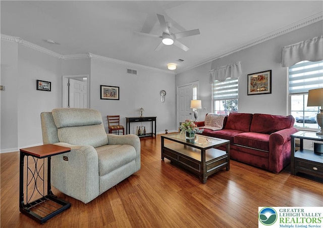4693 Bluegrass Ln, Lower Macungie Twp, PA 18062 - living room with ceiling fan, crown molding, and wood finished floors