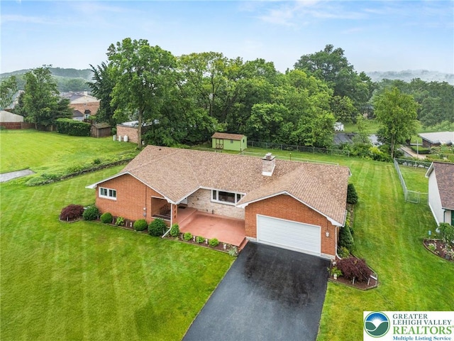 194 Gallagher Rd, Whitehall Twp, PA 18052 - view of front of property with asphalt driveway, an attached garage, a chimney, and a storage unit