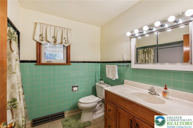 194 Gallagher Rd, Whitehall Twp, PA 18052 - bathroom featuring tile patterned flooring, vanity, a wainscoted wall, tile walls, and curtained shower