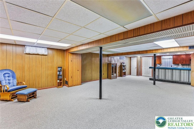 194 Gallagher Rd, Whitehall Twp, PA 18052 - basement featuring a drop ceiling, carpet floors, and wooden walls