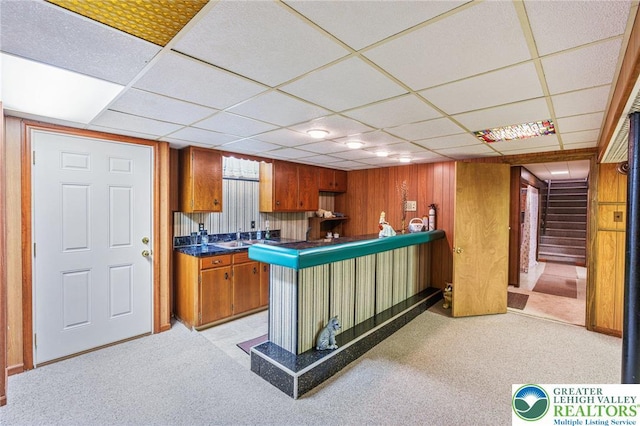 194 Gallagher Rd, Whitehall Twp, PA 18052 - kitchen featuring brown cabinetry, a drop ceiling, light carpet, and dark countertops