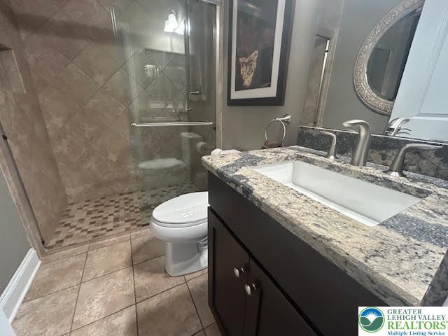1051 Resolution Dr, Hanover Twp, PA 18017 - full bathroom featuring vanity, a shower stall, and tile patterned floors