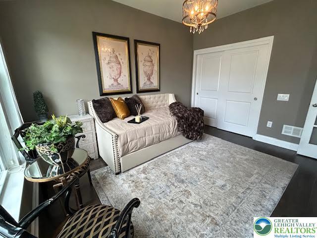 1051 Resolution Dr, Hanover Twp, PA 18017 - living room with a chandelier and wood finished floors