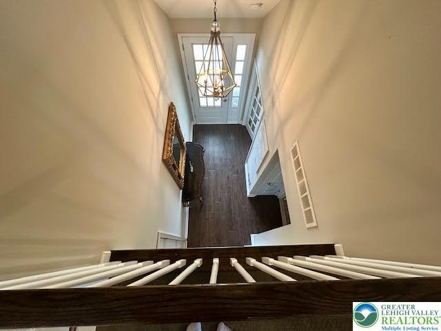 1051 Resolution Dr, Hanover Twp, PA 18017 - staircase featuring a chandelier and wood finished floors