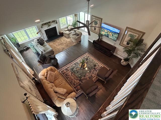1051 Resolution Dr, Hanover Twp, PA 18017 - living room featuring wood finished floors, a high end fireplace, and lofted ceiling
