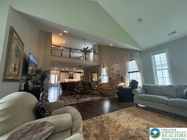 1051 Resolution Dr, Hanover Twp, PA 18017 - living area featuring wood finished floors, high vaulted ceiling, healthy amount of natural light, ceiling fan, and recessed lighting
