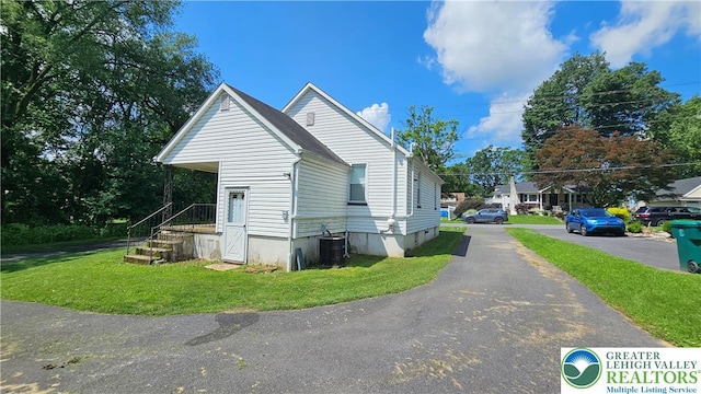 532 Oakwood St, Palmer Twp, PA 18045 - view of side of home featuring a chimney and a lawn