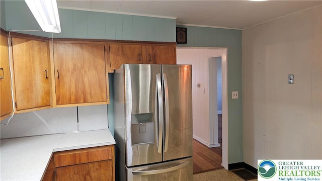 532 Oakwood St, Palmer Twp, PA 18045 - kitchen featuring stainless steel fridge, light countertops, brown cabinetry, and crown molding