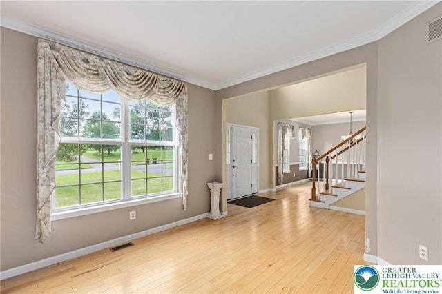 6841 Stone Croft Cir, Macungie Boro, PA 18062 - entryway with crown molding, stairs, hardwood / wood-style flooring, and a chandelier