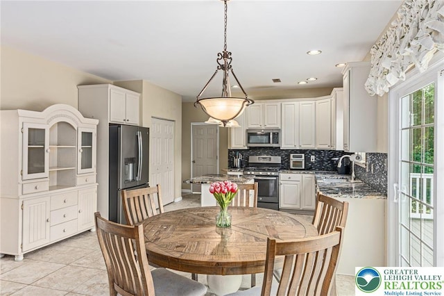 6841 Stone Croft Cir, Macungie Boro, PA 18062 - dining space featuring light tile patterned floors and recessed lighting