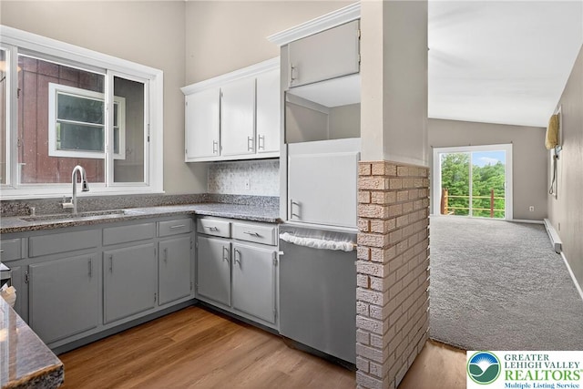 2228 Skyline, Washington Twp, PA 18080 - kitchen with gray cabinetry, lofted ceiling, decorative backsplash, light wood-type flooring, and dark stone countertops
