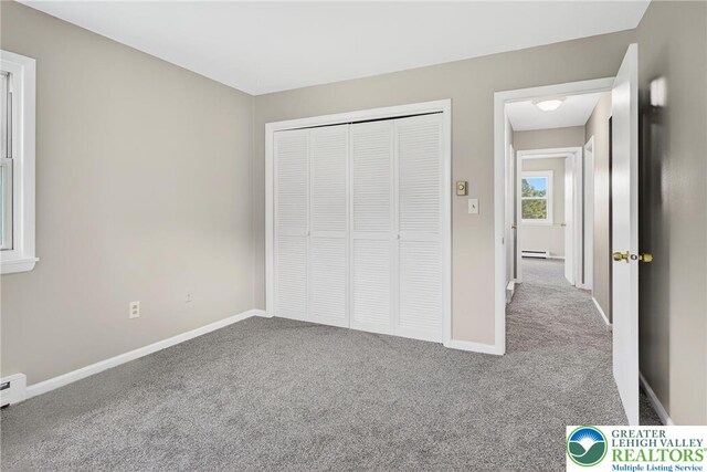 2228 Skyline, Washington Twp, PA 18080 - unfurnished bedroom with carpet, a baseboard radiator, and a closet