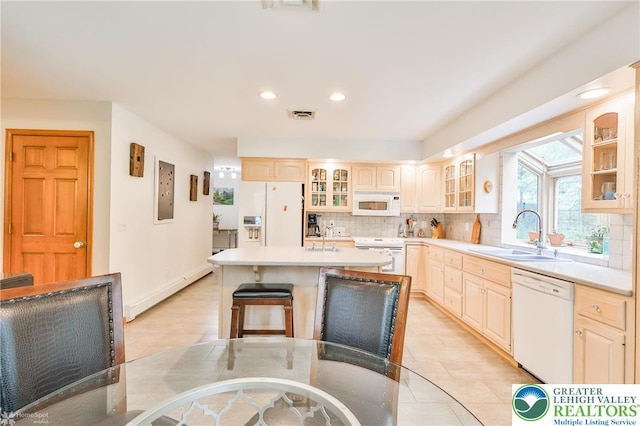 3745 Orefield Rd, South Whitehall Twp, PA 18104 - kitchen featuring white appliances, tasteful backsplash, a kitchen island, glass insert cabinets, and recessed lighting