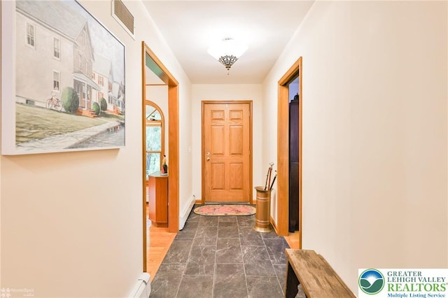 3745 Orefield Rd, South Whitehall Twp, PA 18104 - doorway to outside with dark marble finish flooring and baseboard heating