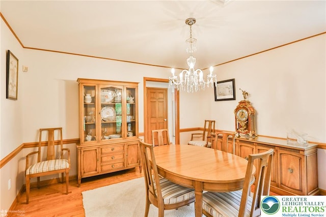 3745 Orefield Rd, South Whitehall Twp, PA 18104 - dining space featuring a chandelier, light wood finished floors, and crown molding