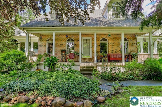 3745 Orefield Rd, South Whitehall Twp, PA 18104 - view of front facade featuring brick siding, a porch, and roof with shingles