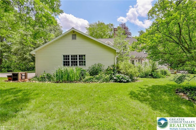 3745 Orefield Rd, South Whitehall Twp, PA 18104 - view of home's exterior with a lawn and a chimney