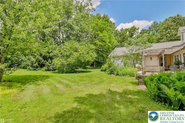 3745 Orefield Rd, South Whitehall Twp, PA 18104 - view of grassy yard featuring a wooden deck and a pergola