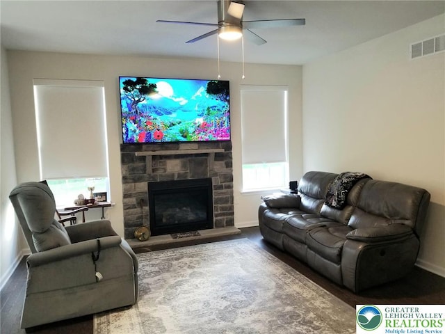 3583 Daylily Dr, Upper Milford Twp, PA 18049 - living area with a ceiling fan and a stone fireplace