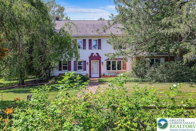 909 Interchange Rd, Polk Twp, PA 18333 - colonial inspired home with a chimney and a front lawn