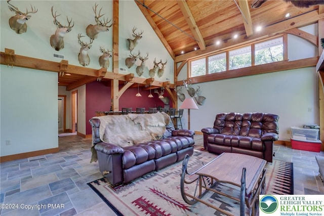 909 Interchange Rd, Polk Twp, PA 18333 - living room with a wooden ceiling with exposed beams, stone finish floors, and high vaulted ceiling