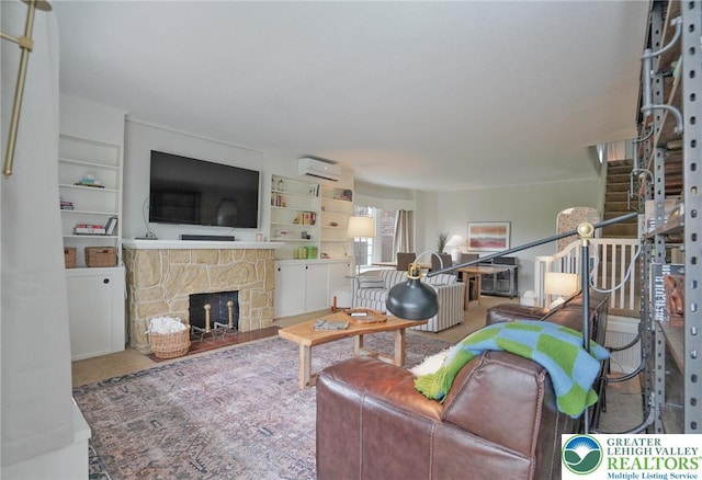 11 11 Ave, D, PA 17972 - living area with a wall mounted air conditioner, a fireplace, and built in features