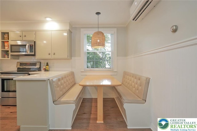 11 11 Ave, D, PA 17972 - kitchen with stainless steel appliances, breakfast area, ornamental molding, a peninsula, and light countertops
