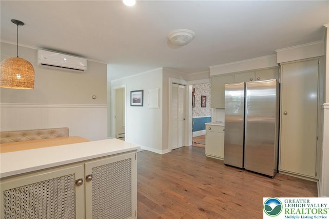 11 11 Ave, D, PA 17972 - kitchen featuring a wall mounted AC, freestanding refrigerator, wood finished floors, light countertops, and crown molding
