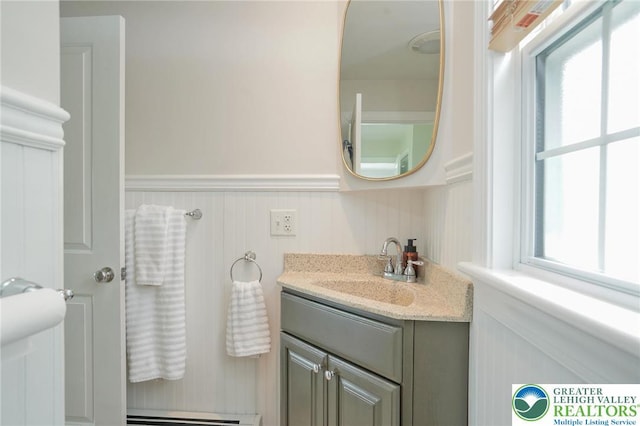 11 11 Ave, D, PA 17972 - bathroom with vanity, a wainscoted wall, and a baseboard heating unit