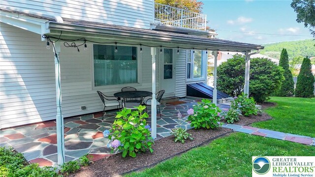 11 11 Ave, D, PA 17972 - doorway to property with a balcony, a patio, and a lawn
