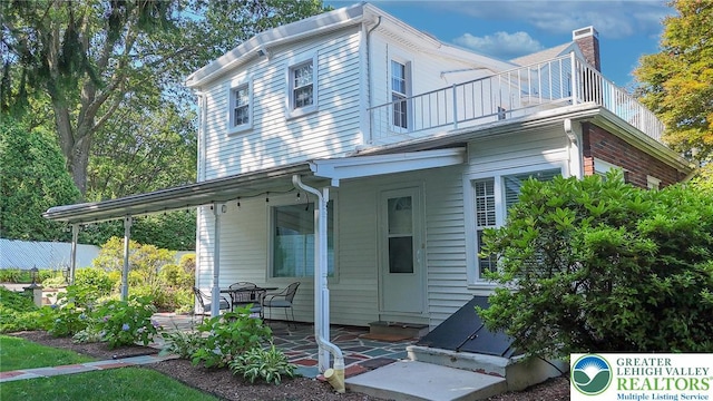 11 11 Ave, D, PA 17972 - back of property with a balcony, a patio, and a chimney