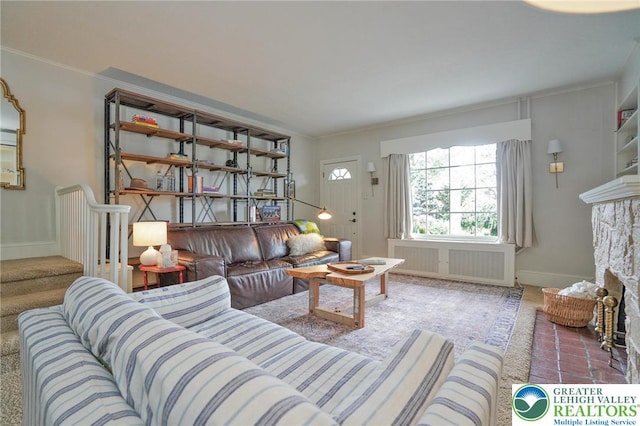11 11 Ave, D, PA 17972 - living room featuring radiator heating unit, a fireplace, crown molding, stairway, and carpet