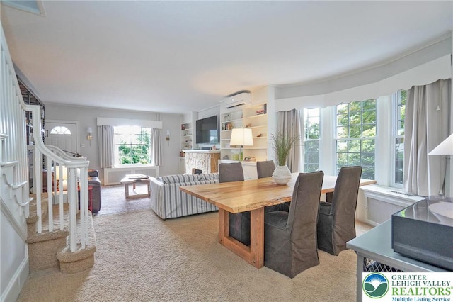 11 11 Ave, D, PA 17972 - dining room featuring a wall mounted air conditioner, stairway, light colored carpet, and radiator