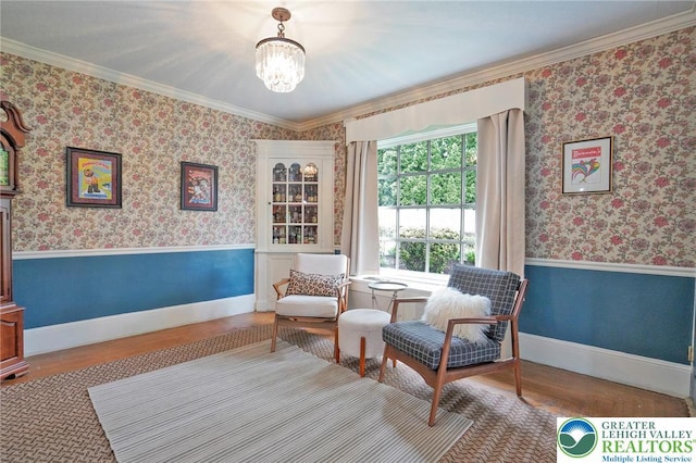 11 11 Ave, D, PA 17972 - sitting room featuring wood finished floors, a chandelier, ornamental molding, a wainscoted wall, and wallpapered walls