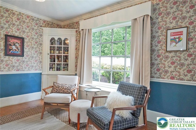 11 11 Ave, D, PA 17972 - sitting room featuring wallpapered walls, plenty of natural light, ornamental molding, wood finished floors, and wainscoting