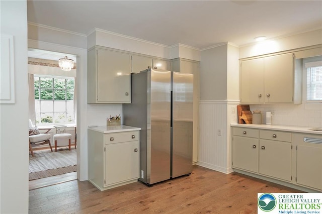 11 11 Ave, D, PA 17972 - kitchen featuring freestanding refrigerator, healthy amount of natural light, light wood-style floors, light countertops, and a wainscoted wall