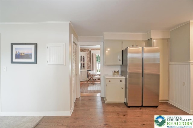 11 11 Ave, D, PA 17972 - kitchen featuring freestanding refrigerator, light wood-type flooring, light countertops, and crown molding