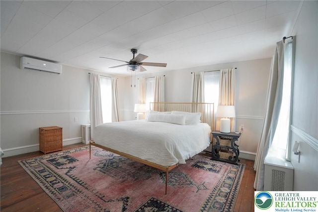 11 11 Ave, D, PA 17972 - bedroom featuring a wall mounted AC, multiple windows, wood finished floors, and ceiling fan