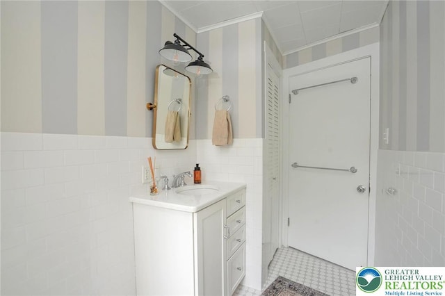 11 11 Ave, D, PA 17972 - bathroom featuring tile walls, vanity, ornamental molding, a wainscoted wall, and wallpapered walls