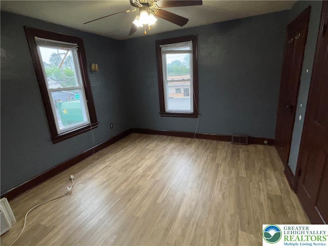 565 Moorestown Dr, Moore Twp, PA 18014 - spare room featuring healthy amount of natural light, wood finished floors, and ceiling fan