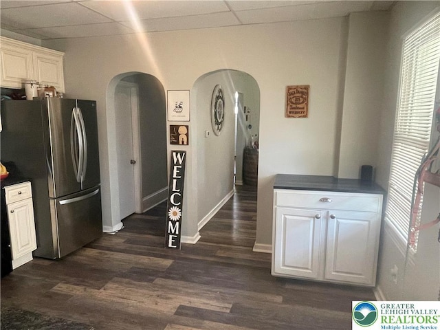 924 W Berwick St, Easton, PA 18042 - kitchen with freestanding refrigerator, arched walkways, a drop ceiling, dark countertops, and dark wood finished floors