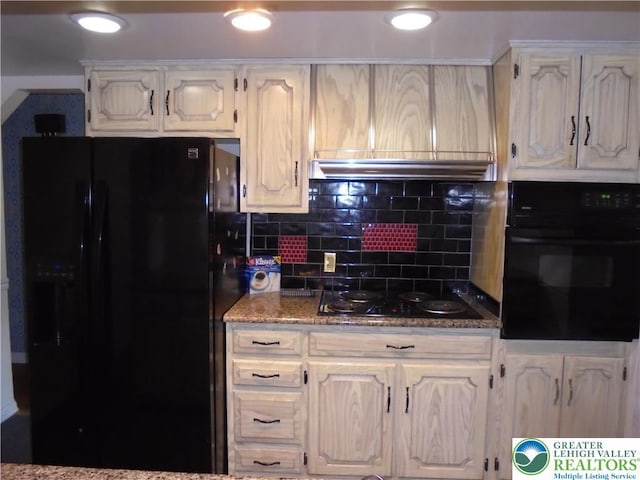 2546 Wehr Mill Rd, South Whitehall Twp, PA 18069 - kitchen with black appliances, white cabinets, tasteful backsplash, under cabinet range hood, and dark stone counters