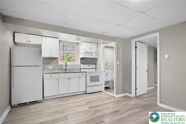 624 N Maxwell St, Allentown City, PA 18109 - kitchen featuring white appliances, light wood-style flooring, white cabinets, a drop ceiling, and light stone countertops