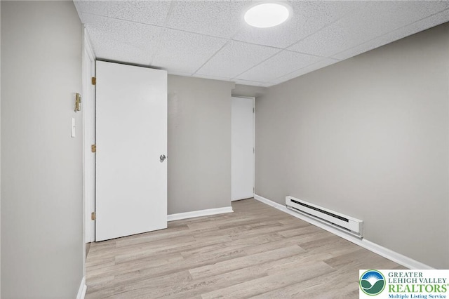 624 N Maxwell St, Allentown City, PA 18109 - unfurnished bedroom with a baseboard radiator and wood finished floors