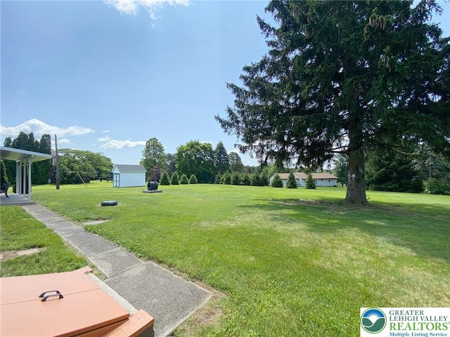 3111 Pheasant Dr, Moore Twp, PA 18067 - view of grassy yard featuring a storage shed