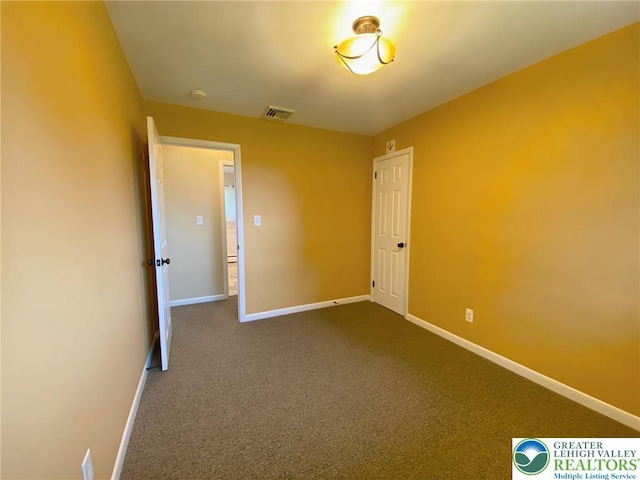 3111 Pheasant Dr, Moore Twp, PA 18067 - unfurnished room featuring dark colored carpet and a smoke detector