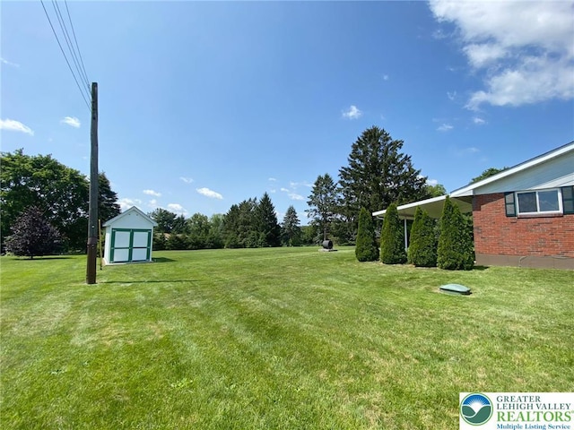 3111 Pheasant Dr, Moore Twp, PA 18067 - view of green lawn with a storage unit